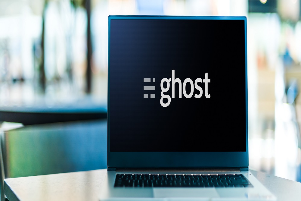 Laptop computer displaying logo of Ghost
