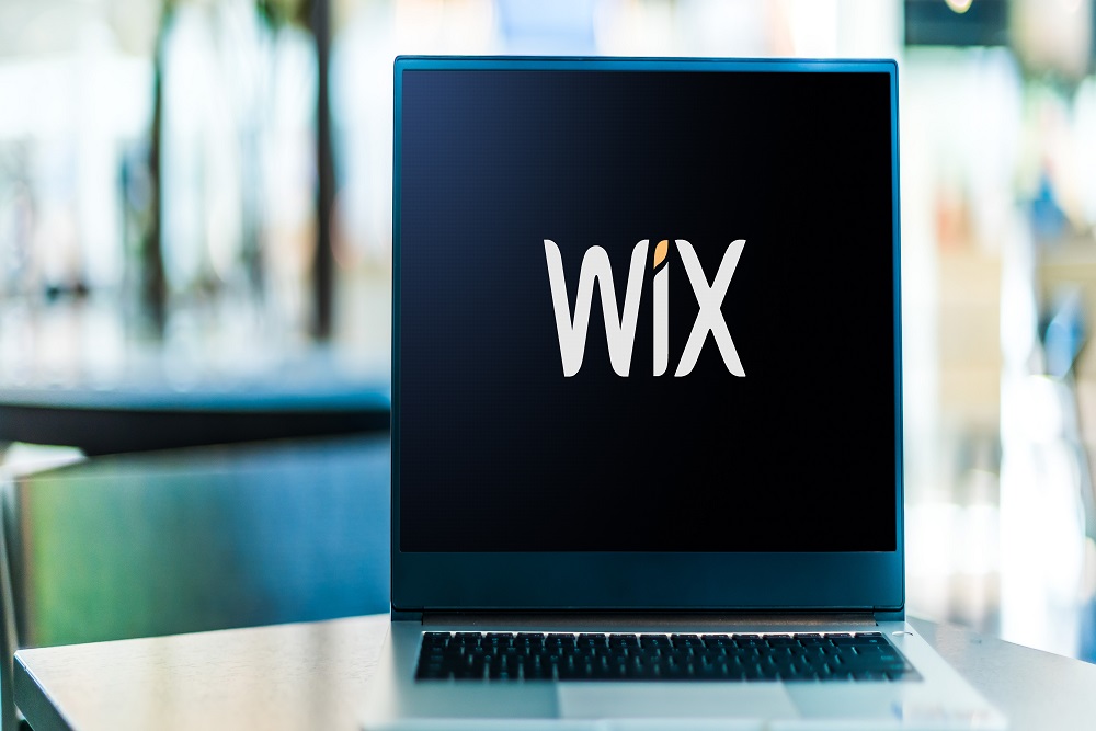 Laptop computer displaying logo of Wix