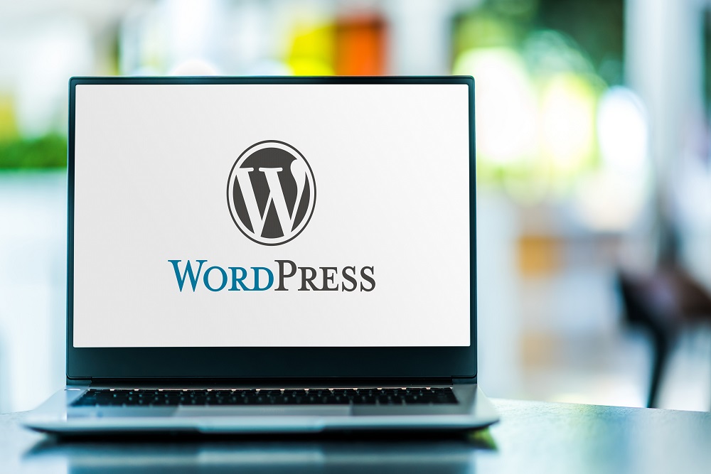 Laptop computer displaying logo of WordPress